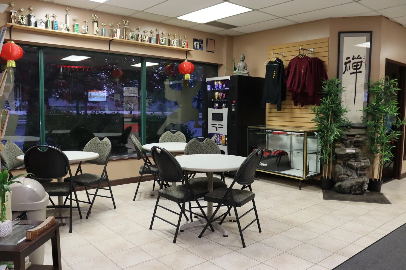 The family lounge with tables, chairs and trophy displays