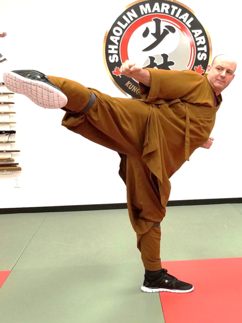 Shifu Tim Wakefield demonstrating a kung-fu side kick at Shaolin Martial Arts Canada